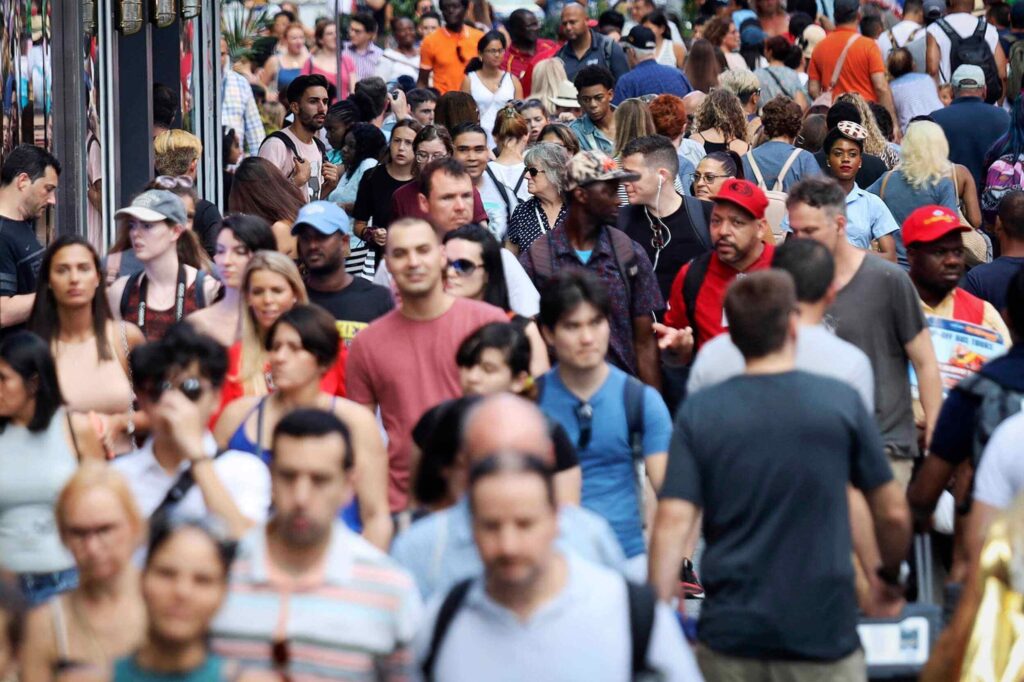 Image of a crowd of white people observed when moving to the UK