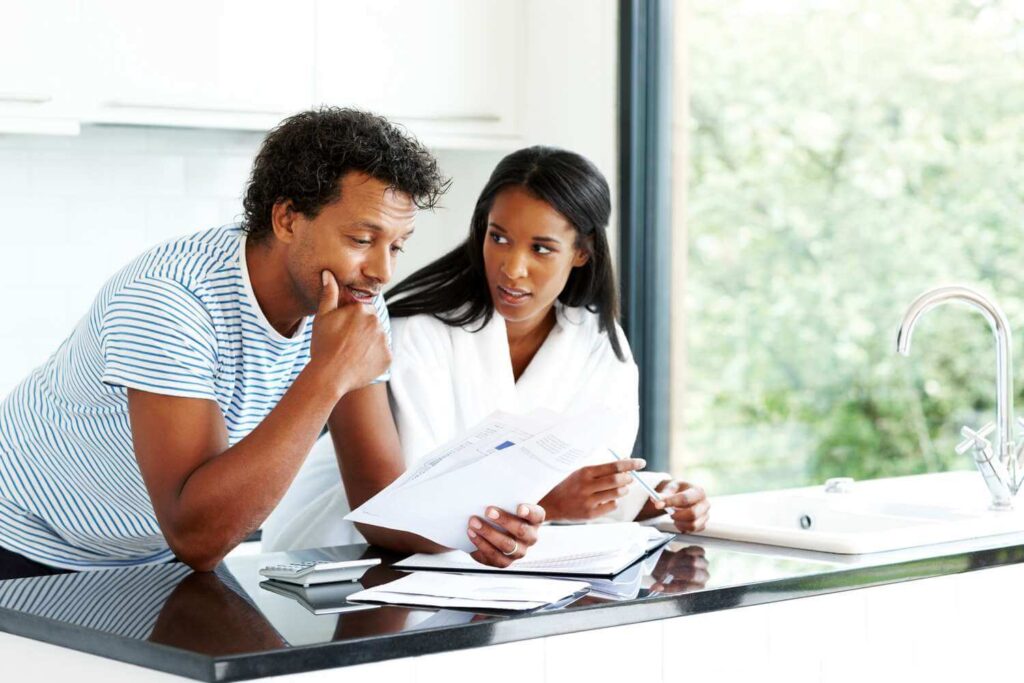 Image of a man talking with his wife about their credit rating