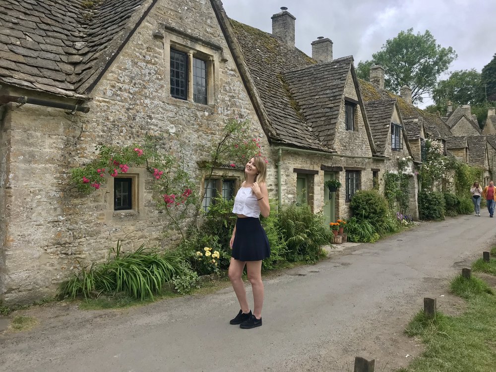 Image of a lady taking a picture in the UK