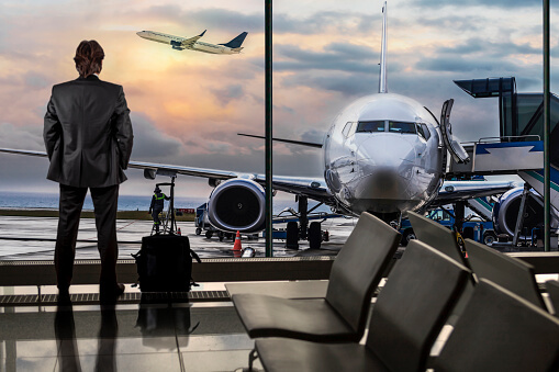 Image of a man in an airport moving to the UK