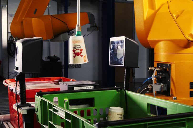 Image of an Ocado robot being used in a grocery store