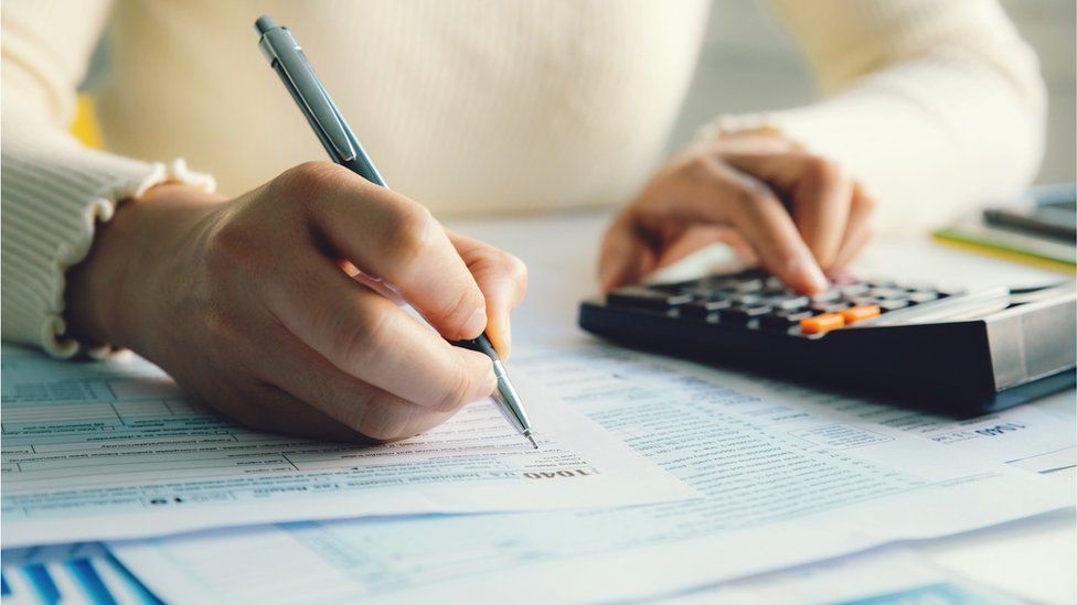 Image of a person doing his taxes in malta