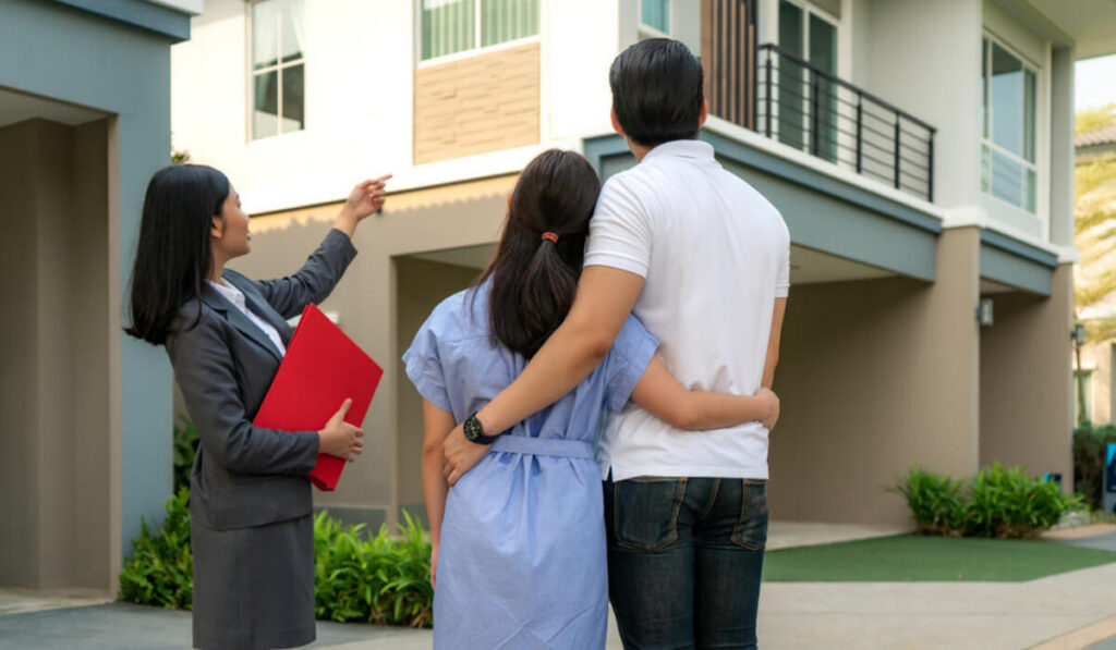 Image of a rental agent showing her client around a property