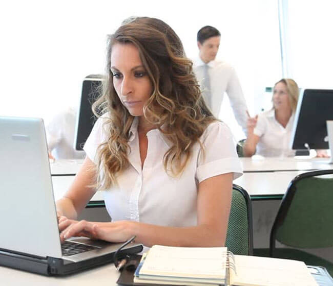 Image of an office assistant working in the office