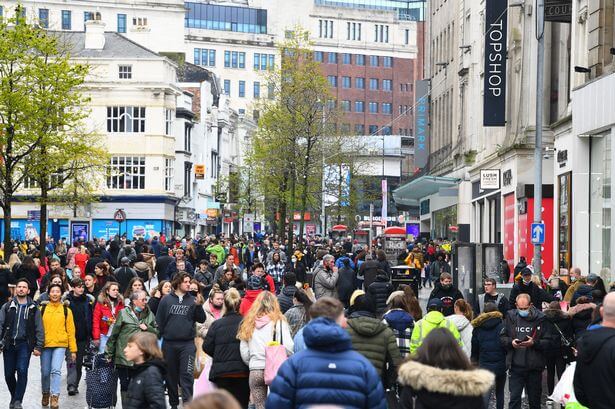 Image of Liverpool city center with people busily walking around