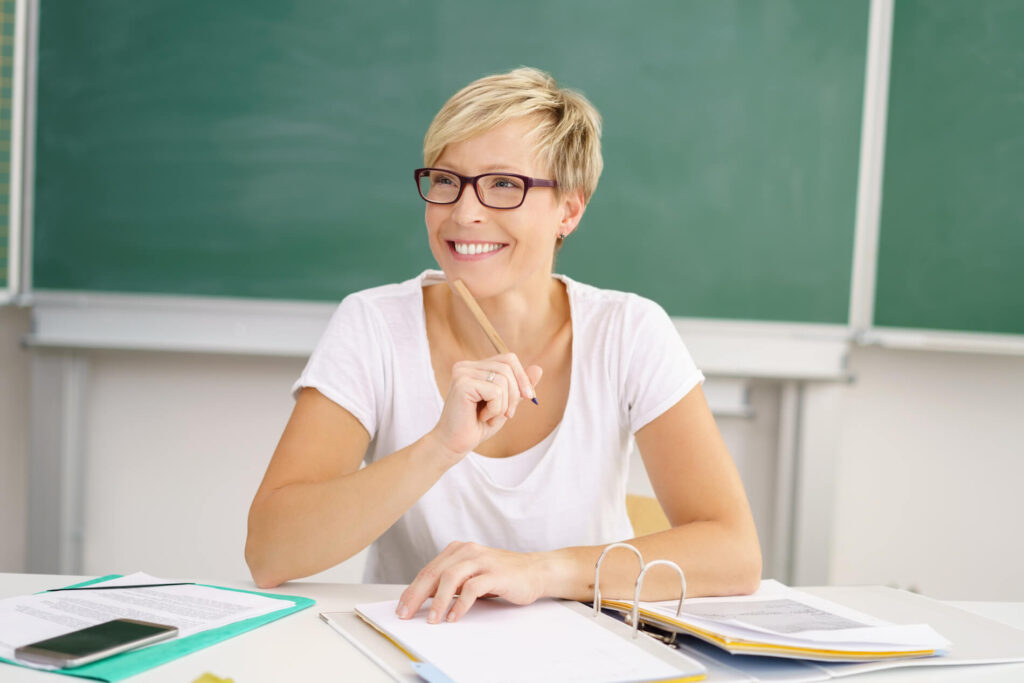 Image of a school teacher doing administrative work in class