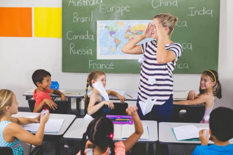 Image of a teacher interview questions and answers assessed teacher managing a class of pupils