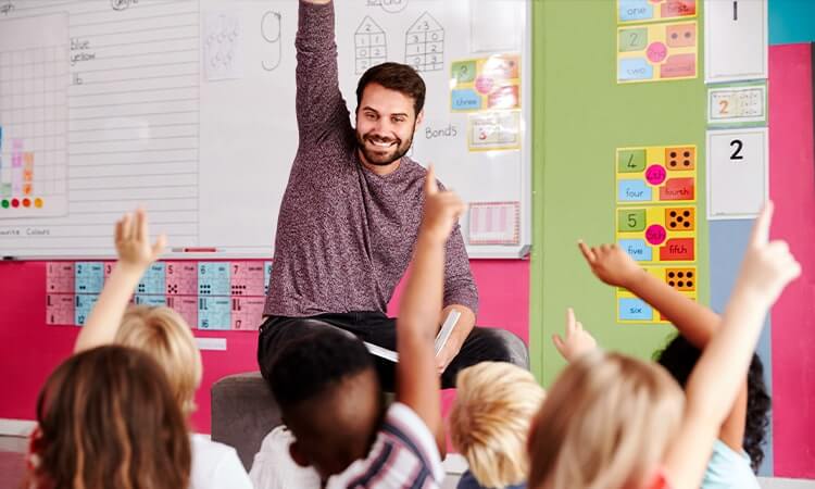 Image of a teacher teaching after moving to the UK