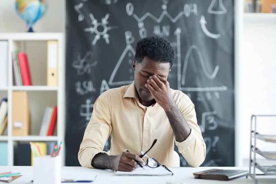 Image of a teacher burned out in class