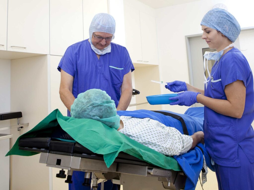 Image of a team of endoscopy nurses working with a patient