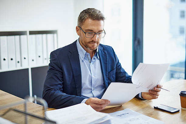 Image of an immigration official processing travel documents