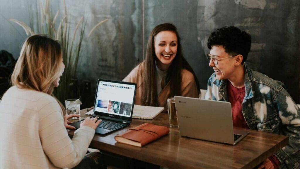 Image of work colleagues having little talk while working for a company in Sweden