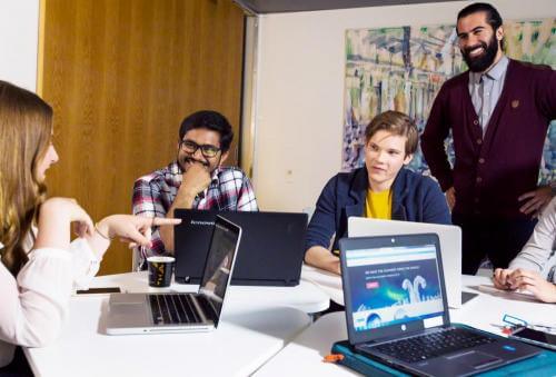 Image of work colleagues having a chat in the office