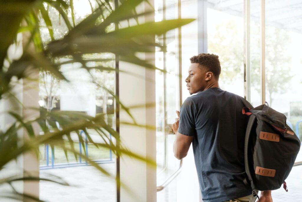 An African student studying in the UK, heading out from after a class 