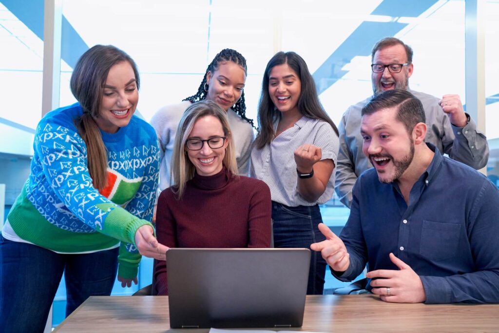 PhD students studying in the UK and happy working in a group to get a project done