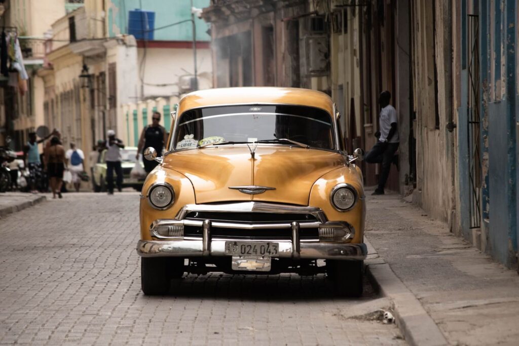 Yellow classic car in Cuba