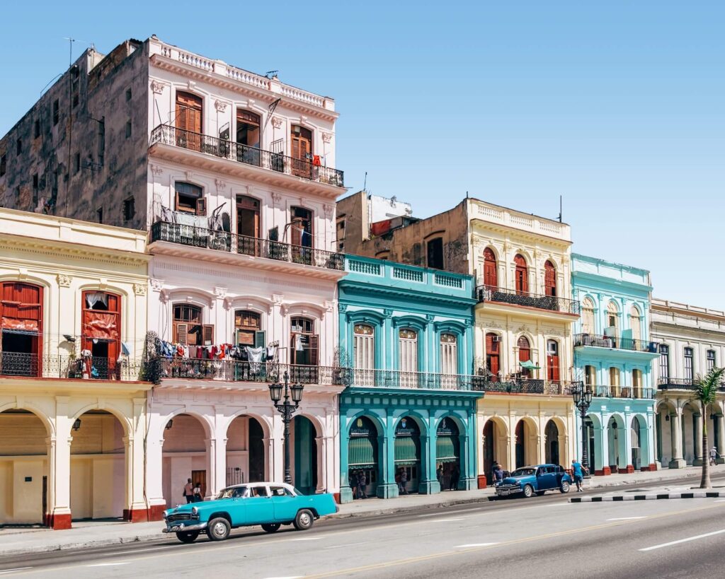 Beautiful streets of Cuba, with 2 cars on the road.