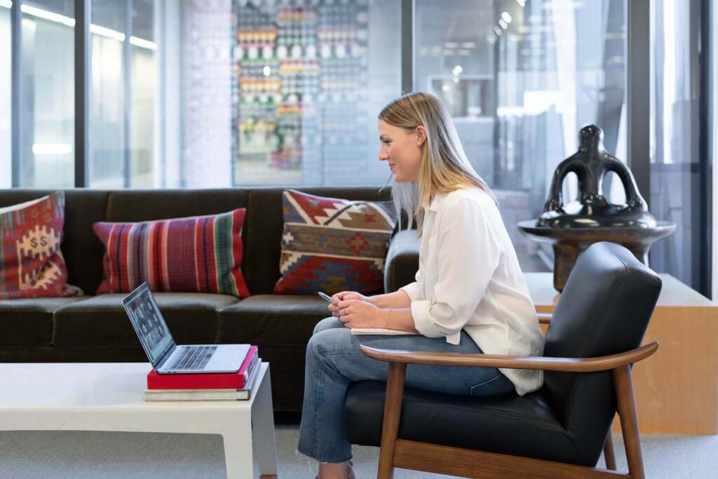 A woman being virtually interviewed for position in Intesa Sanpaolo