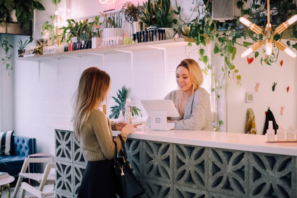 In learning how to become a travel agent, the woman is also being taught how to be a good customer service representative