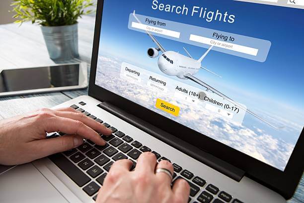 A man trying to book a trip to pay Flight Tickets In Instalments